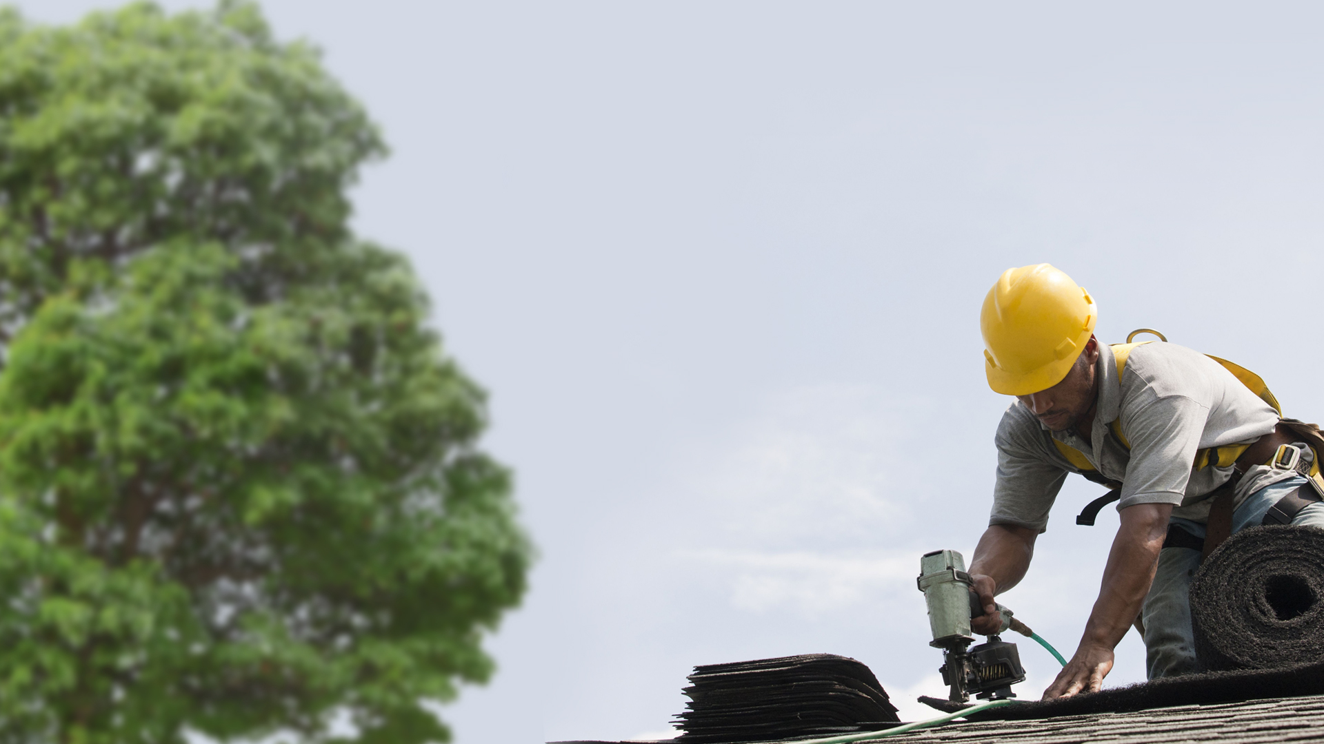 Empire Roofing Roofer Working On Roof